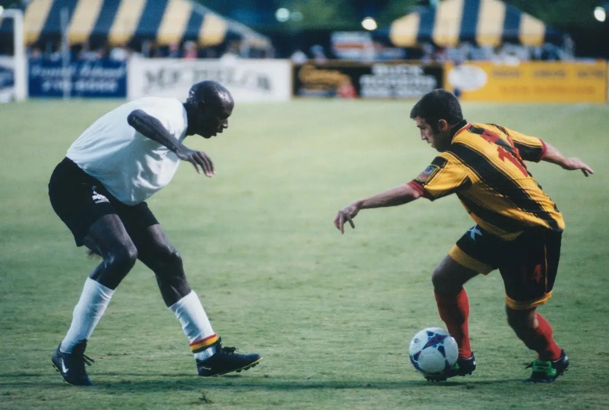 Archival photo of a match from Jon Akin's professional playing career